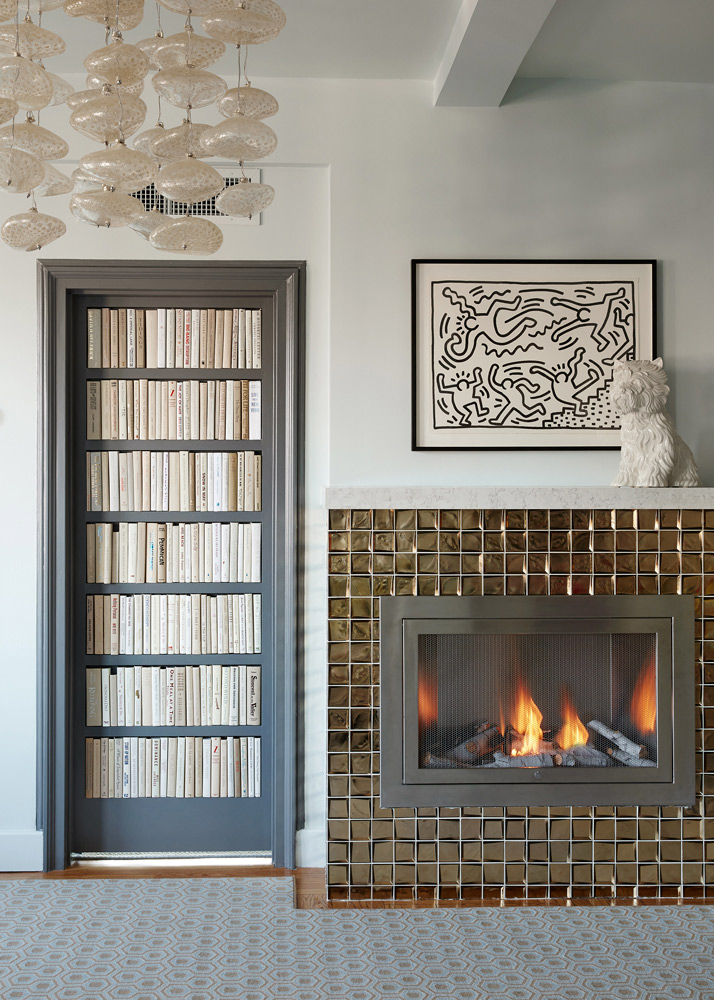 Bookcase design and fireplace in a NYC apartment designed by Annette Jaffe Interiors