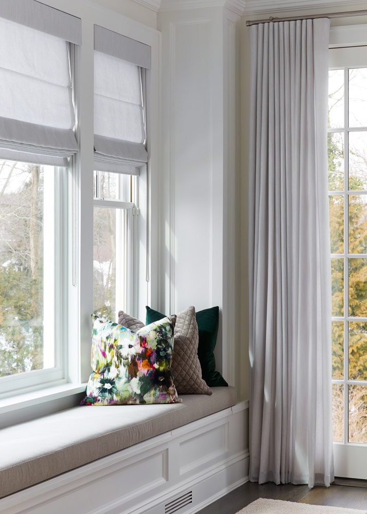 Picturesque window seat design by Annette Jaffe Interiors in a home on Long Island